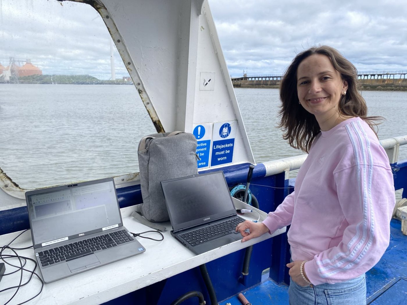 Researcher at the laptop station on board during sea trials
