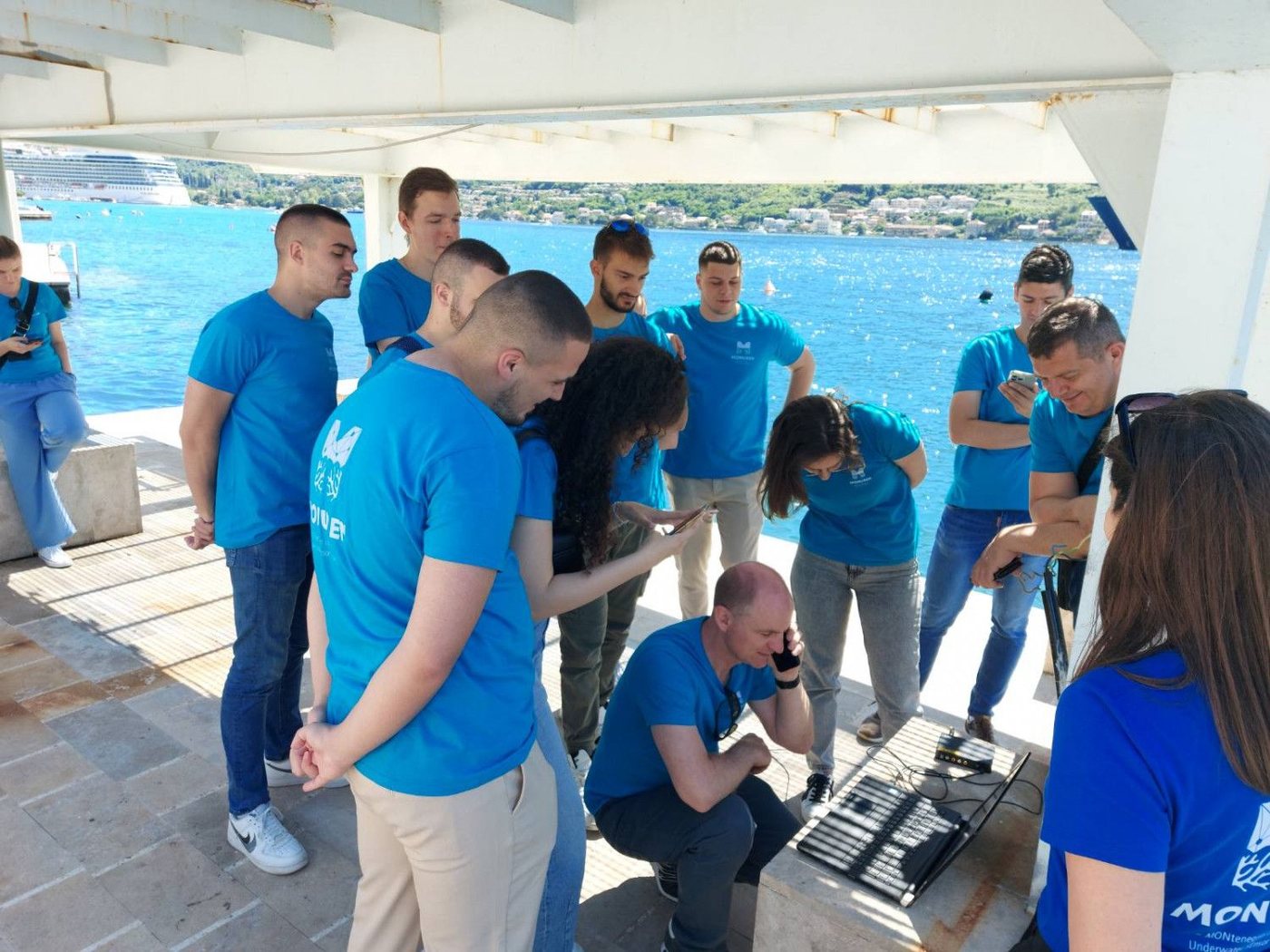 Participants following a live acoustic test on the waterfront